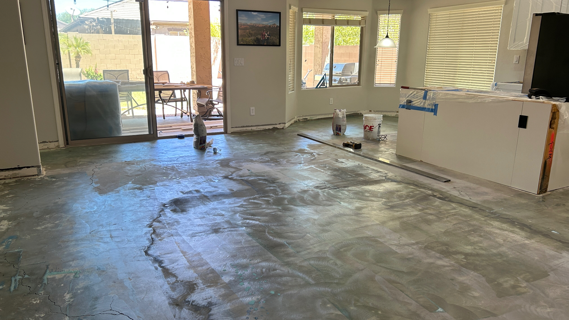 Before: Bare concrete → Wide-plank LVP in Phoenix, AZ